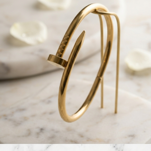 industrialist gold bangle handcuf